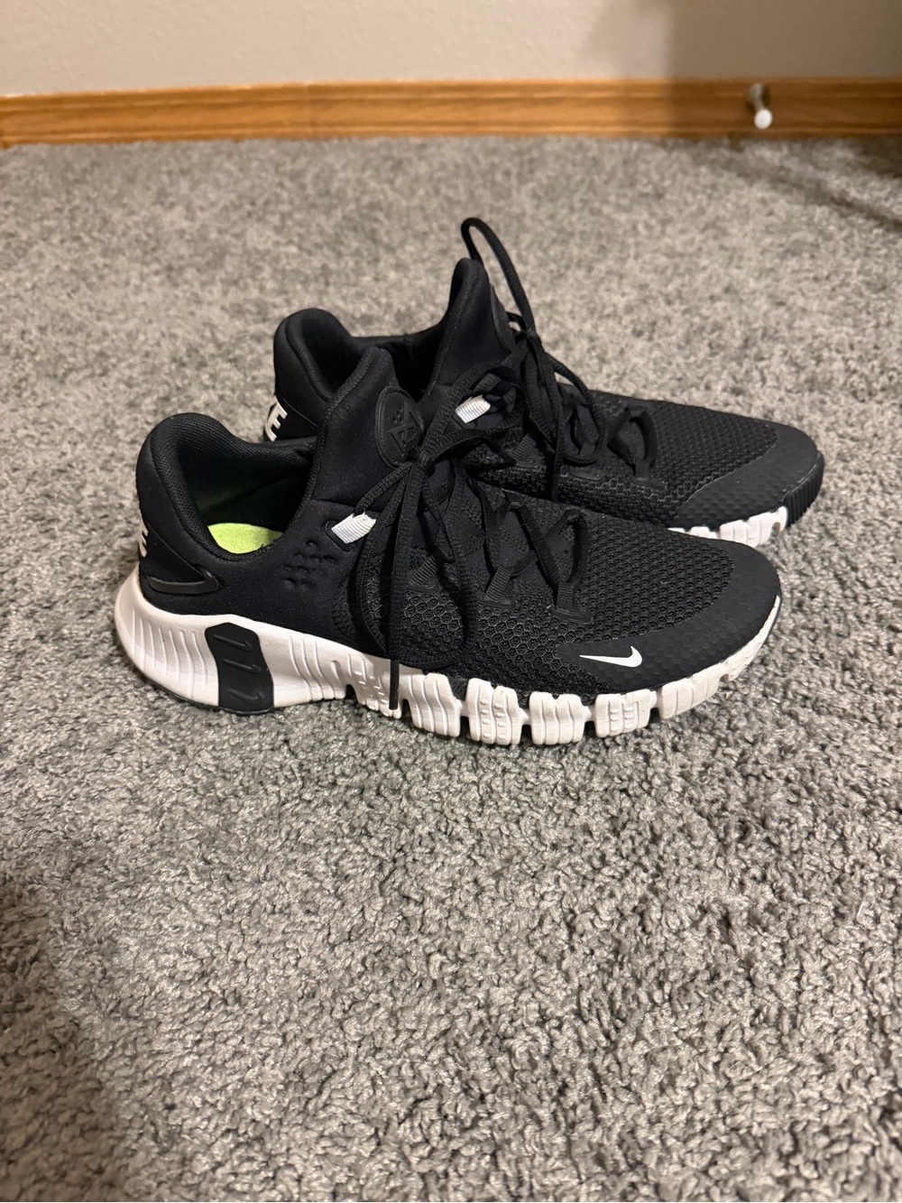 Nike Metcons Black and White Tennis Shoes